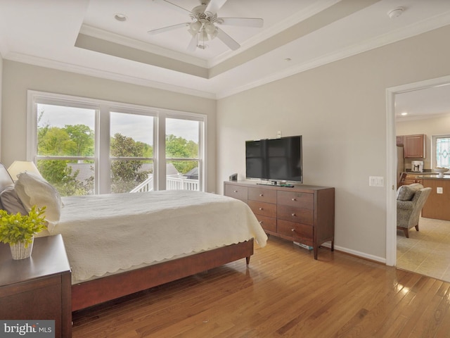 29 Norwood Ln, Fredericksburg, VA 22406 - bedroom featuring crown molding, a tray ceiling, baseboards, and light wood finished floors