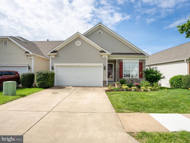 29 Norwood Ln, Fredericksburg, VA 22406 - townhome / multi-family property featuring concrete driveway, a front yard, and a garage
