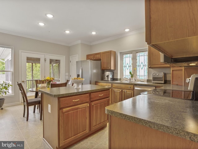 29 Norwood Ln, Fredericksburg, VA 22406 - kitchen with crown molding, appliances with stainless steel finishes, a center island, dark countertops, and a sink