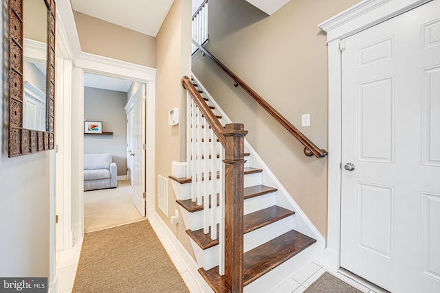 stairway with carpet flooring