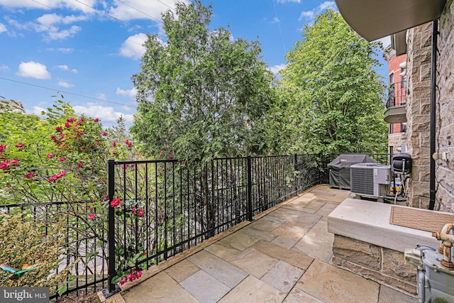 balcony featuring a grill and central AC unit