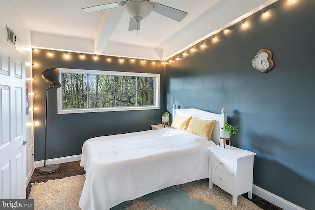 bedroom with baseboards, visible vents, and ceiling fan