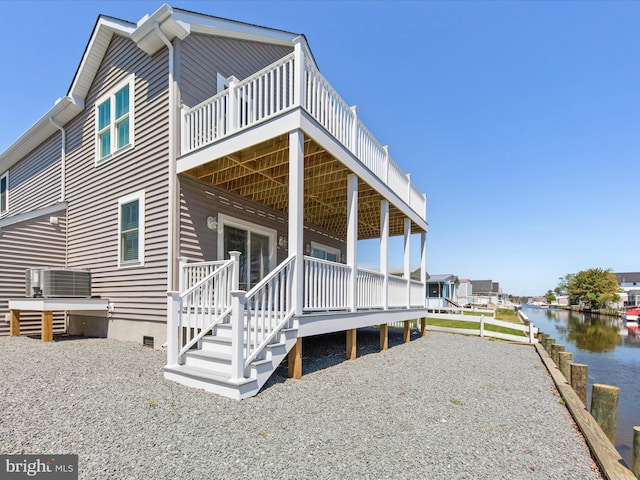 36986 Blue Teal Rd, Selbyville, DE 19975 - view of property exterior with crawl space, central AC unit, and a deck with water view