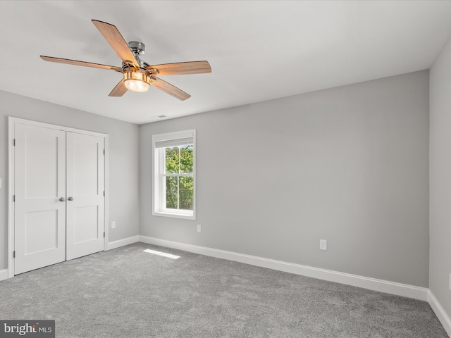 36986 Blue Teal Rd, Selbyville, DE 19975 - unfurnished bedroom with a closet, baseboards, ceiling fan, and carpet flooring