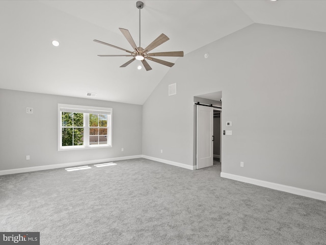 36986 Blue Teal Rd, Selbyville, DE 19975 - interior space with high vaulted ceiling, ceiling fan, a barn door, and visible vents