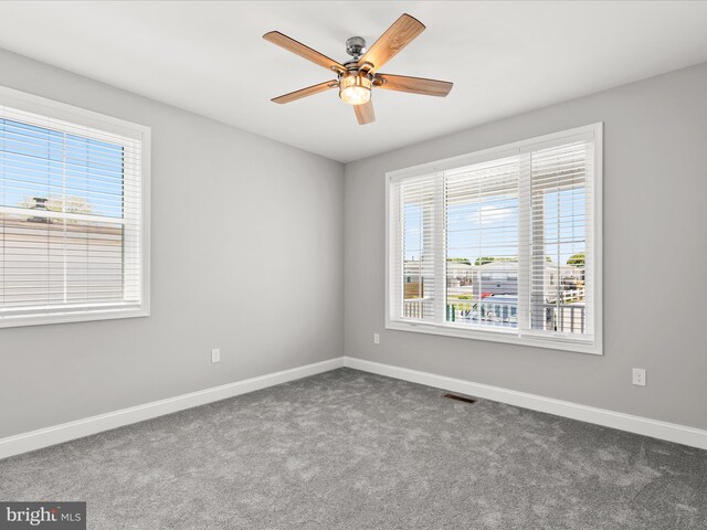 36986 Blue Teal Rd, Selbyville, DE 19975 - carpeted spare room with visible vents, a ceiling fan, and baseboards