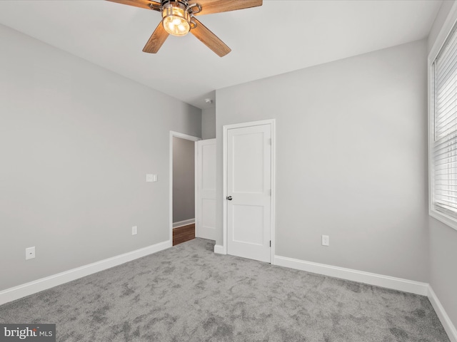 36986 Blue Teal Rd, Selbyville, DE 19975 - unfurnished bedroom with carpet floors, a ceiling fan, and baseboards