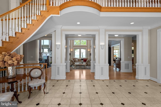 285 Eagle Hill Rd, Pasadena, MD 21122 - tiled foyer entrance featuring wainscoting, a decorative wall, recessed lighting, ornate columns, and ornamental molding