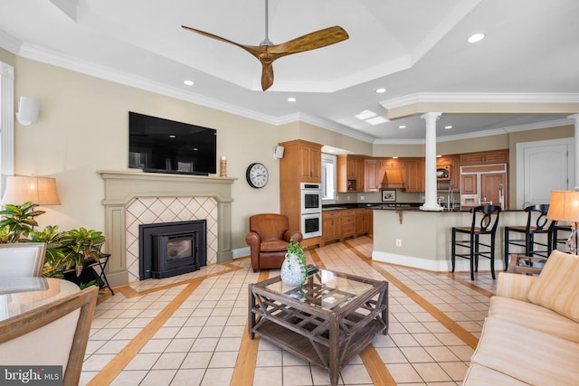 285 Eagle Hill Rd, Pasadena, MD 21122 - living room featuring recessed lighting, a ceiling fan, a fireplace with flush hearth, light tile patterned floors, and ornate columns
