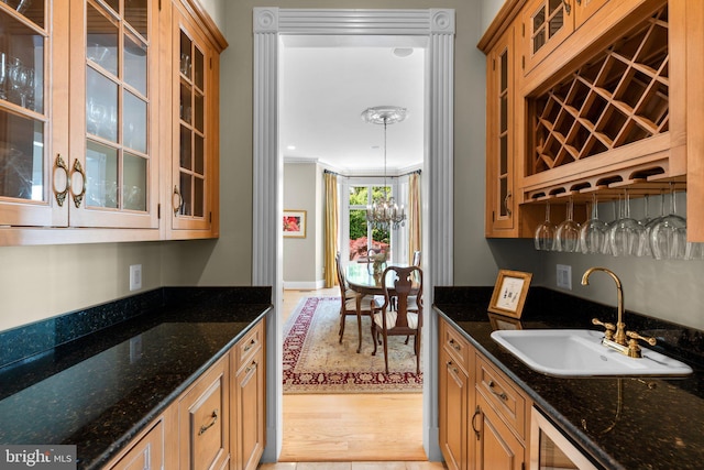 285 Eagle Hill Rd, Pasadena, MD 21122 - bar featuring beverage cooler, ornamental molding, a sink, and light wood-style floors