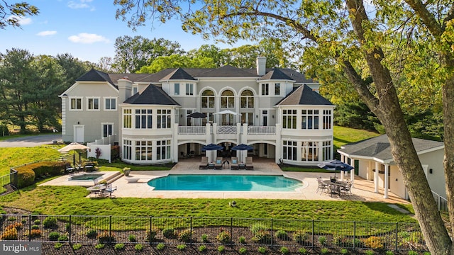285 Eagle Hill Rd, Pasadena, MD 21122 - back of property featuring a lawn, a patio, an in ground hot tub, and a balcony