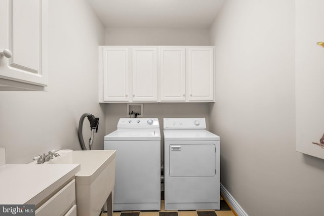 285 Eagle Hill Rd, Pasadena, MD 21122 - clothes washing area with cabinet space, separate washer and dryer, and a sink