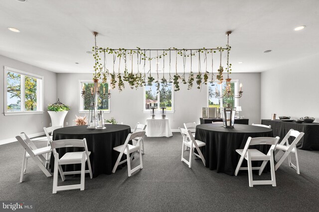 285 Eagle Hill Rd, Pasadena, MD 21122 - dining room with dark colored carpet, recessed lighting, baseboards, and an inviting chandelier