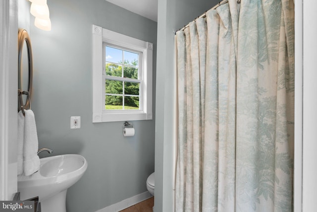 285 Eagle Hill Rd, Pasadena, MD 21122 - bathroom with a sink, baseboards, and toilet