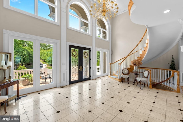 285 Eagle Hill Rd, Pasadena, MD 21122 - entryway with stairs, a high ceiling, a wealth of natural light, and french doors