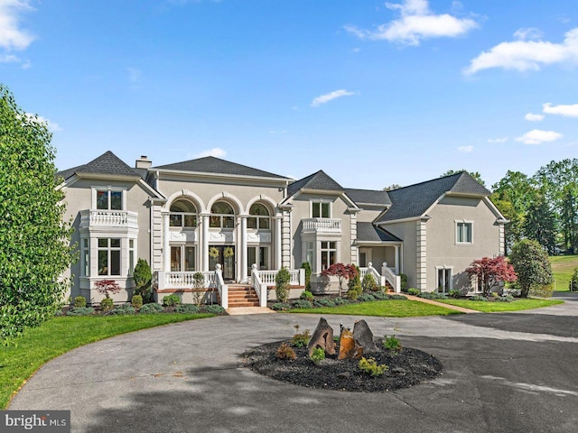 285 Eagle Hill Rd, Pasadena, MD 21122 - view of front of property with a balcony, stucco siding, and covered porch