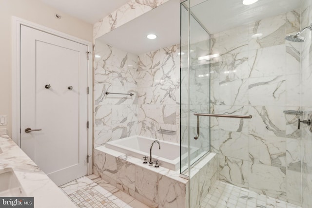 bathroom featuring recessed lighting, a marble finish shower, and a garden tub