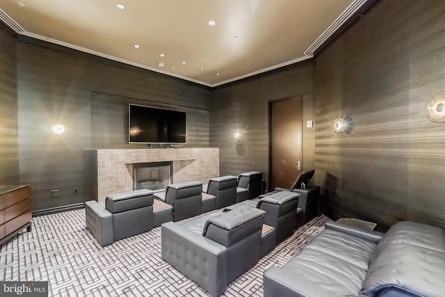 home theater with a fireplace, recessed lighting, wallpapered walls, baseboards, and ornamental molding