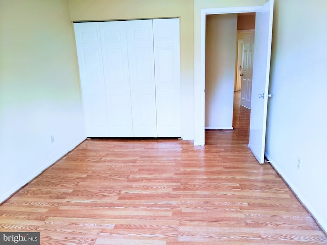 18478 Stone Holw, Germantown, MD 20874 - unfurnished bedroom featuring baseboards, a closet, and light wood-type flooring