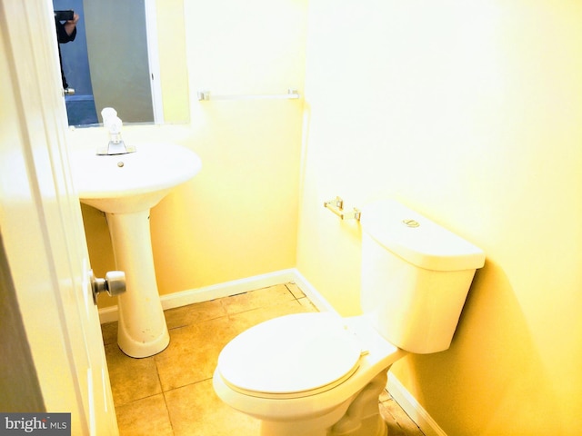 18478 Stone Holw, Germantown, MD 20874 - bathroom featuring toilet, tile patterned flooring, a sink, and baseboards