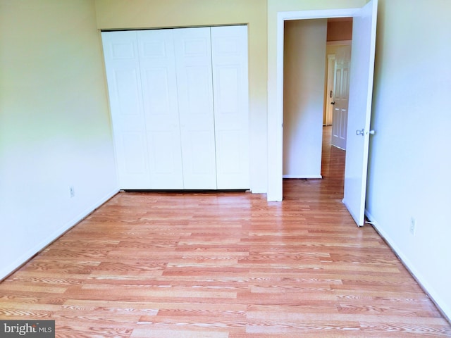 18478 Stone Holw, Germantown, MD 20874 - unfurnished bedroom featuring baseboards, light wood finished floors, and a closet