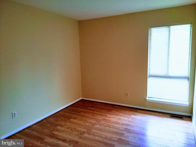 18478 Stone Holw, Germantown, MD 20874 - spare room featuring baseboards, visible vents, and wood finished floors
