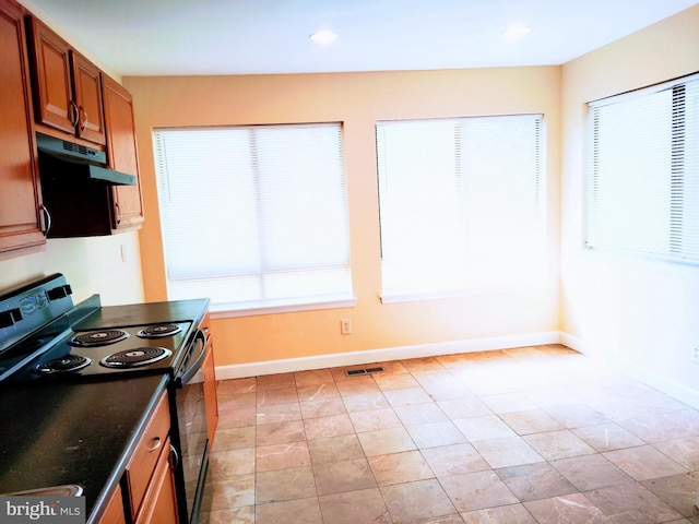 18478 Stone Holw, Germantown, MD 20874 - kitchen featuring brown cabinets, electric range, visible vents, baseboards, and under cabinet range hood