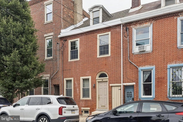 805 N 5th St, Philadelphia, PA 19123 - view of front of property featuring brick siding and a chimney