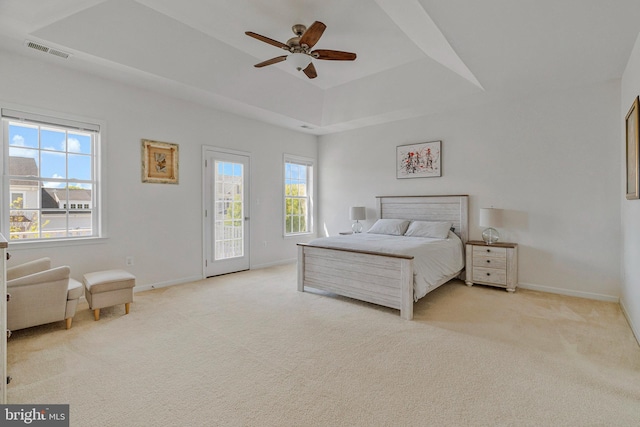 bedroom with baseboards, access to outside, light carpet, and visible vents
