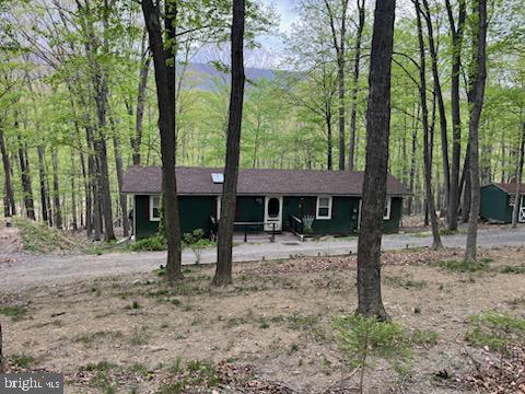 single story home with covered porch