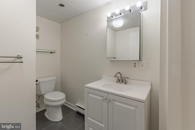 half bathroom with toilet, tile patterned floors, a baseboard heating unit, and vanity