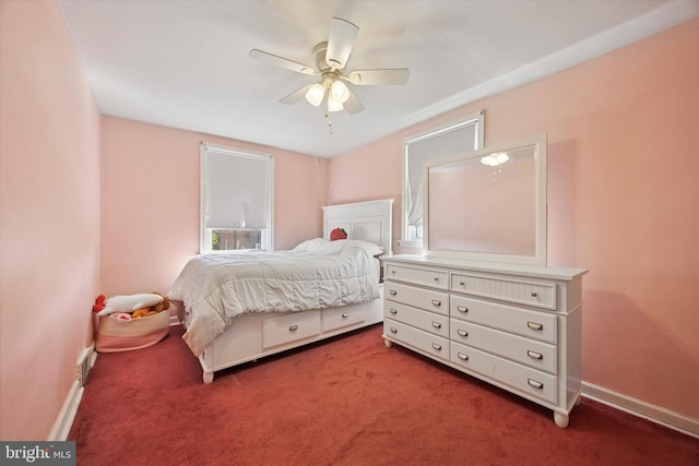 bedroom with ceiling fan, baseboards, and carpet