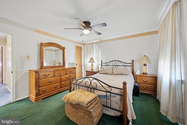carpeted bedroom featuring baseboards, ceiling fan, and a closet