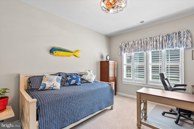 carpeted bedroom with visible vents and baseboards