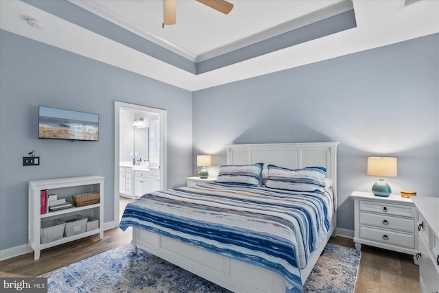 bedroom featuring baseboards, ceiling fan, connected bathroom, crown molding, and wood finished floors