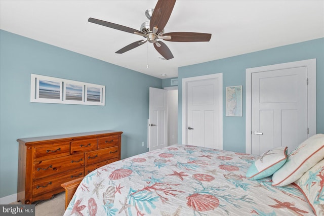 carpeted bedroom featuring a ceiling fan