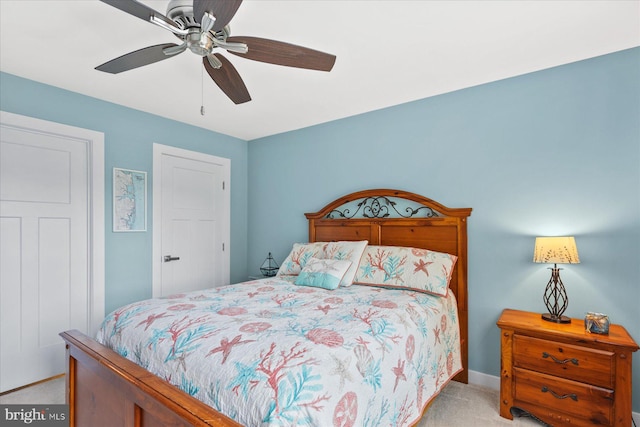 bedroom featuring carpet flooring, baseboards, and a ceiling fan
