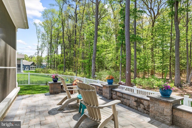 view of patio / terrace featuring fence