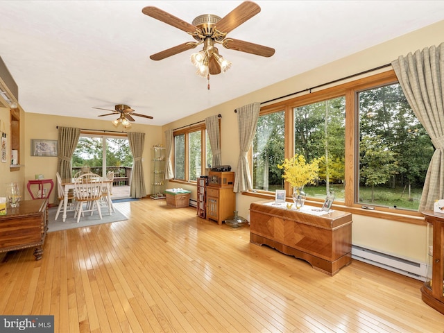 11615 Taneytown Pike, Emmitsburg, MD 21727 - sunroom / solarium featuring a baseboard radiator, a wooden deck, and hardwood / wood-style floors
