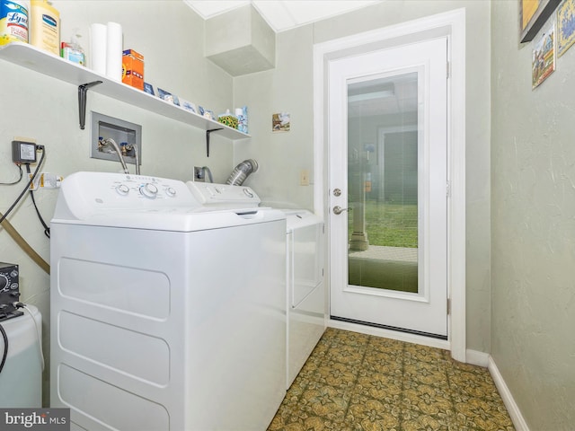 11615 Taneytown Pike, Emmitsburg, MD 21727 - laundry room featuring separate washer and dryer, baseboards, laundry area, and a textured wall