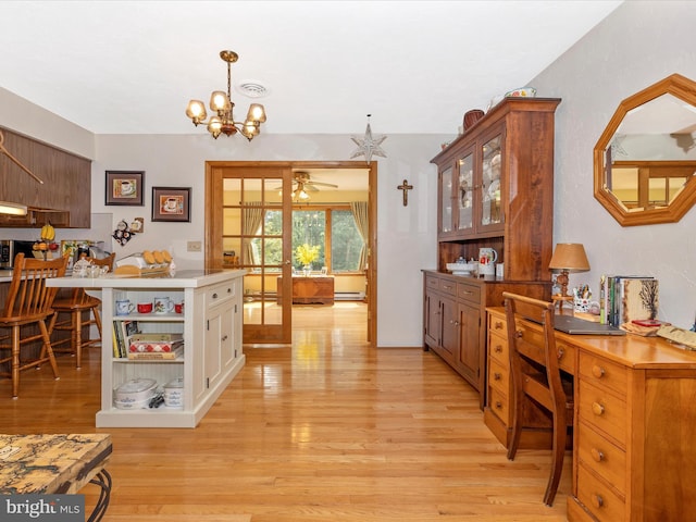 11615 Taneytown Pike, Emmitsburg, MD 21727 - dining room with french doors, ceiling fan with notable chandelier, light wood finished floors, and a baseboard heating unit