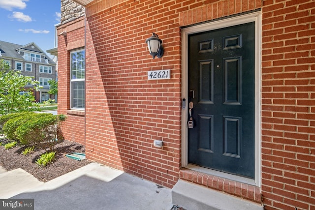 42621 Capitol View Ter, Broadlands, VA 20148 - doorway to property featuring brick siding