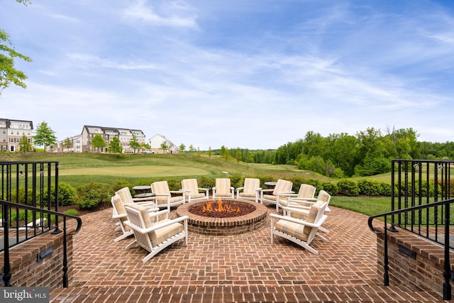 view of patio / terrace with an outdoor fire pit