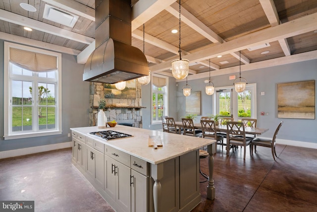 kitchen featuring baseboards, plenty of natural light, wood ceiling, and finished concrete floors