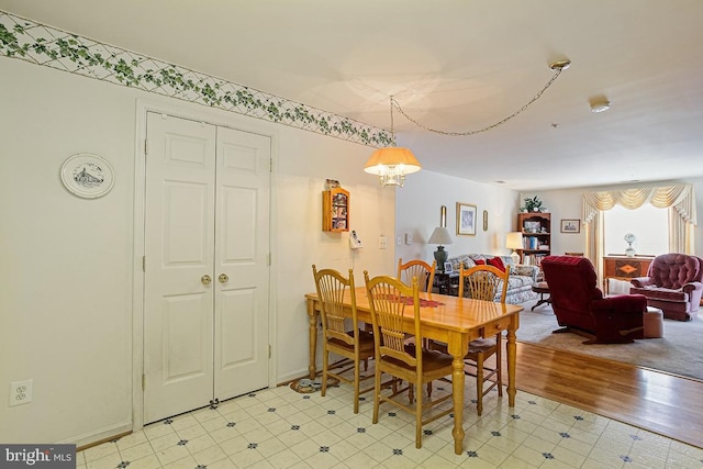 dining space with a chandelier