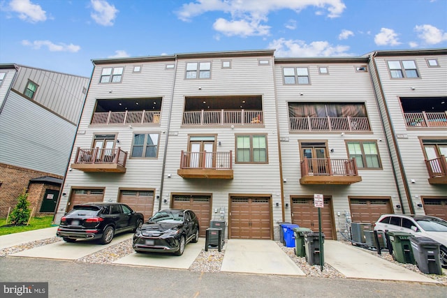 17438 Southern Shores Dr, Dumfries, VA 22026 - view of building exterior featuring an attached garage, driveway, and central air condition unit