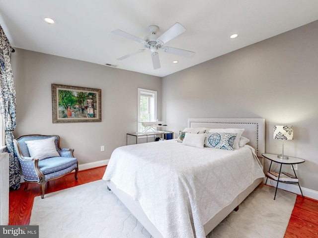 bedroom with wood finished floors, baseboards, a ceiling fan, and recessed lighting