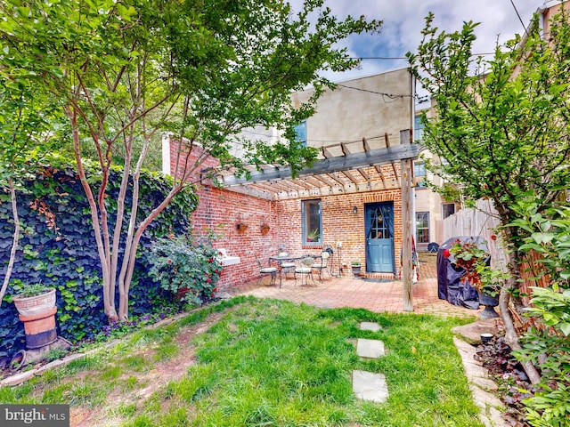 view of yard with a pergola and a patio area