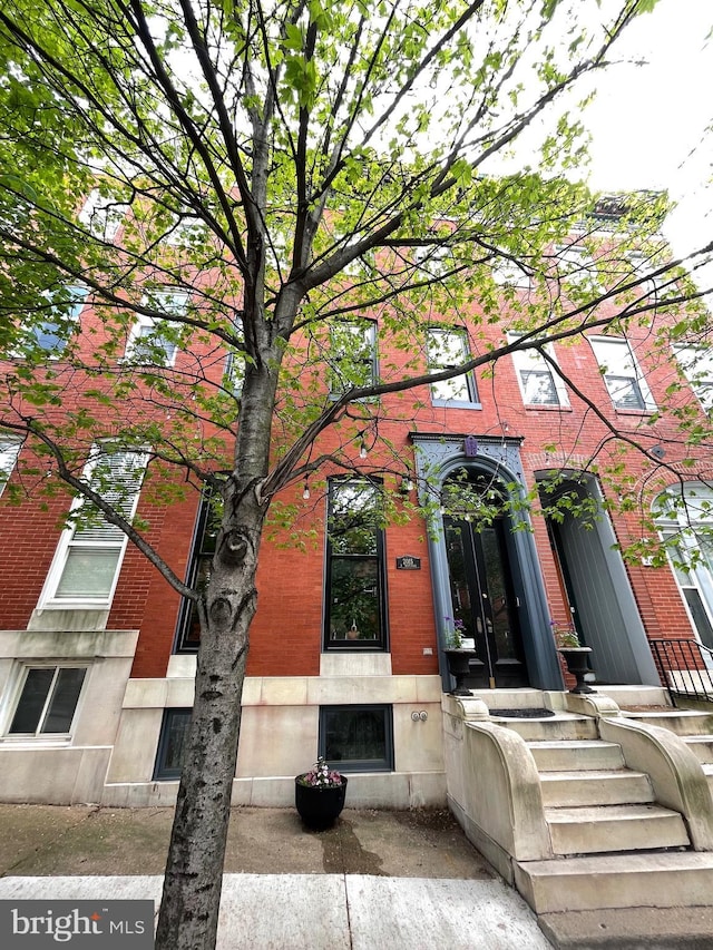 entrance to property with brick siding