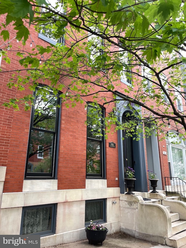 property entrance with brick siding